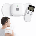 Man using the Wellue wireless 4-channel TENS therapy pod on his shoulder with the mini remote control
