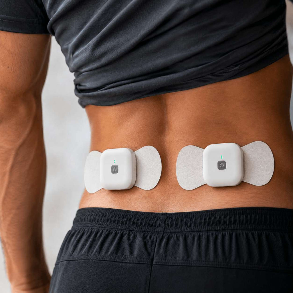 Wellue wireless TENS therapy device shown on a male lower back for drug-free muscle pain relief